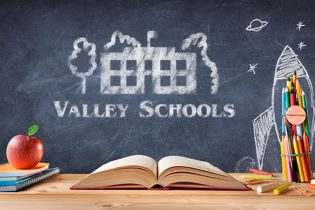 Valley Schools logo on a chalkboard