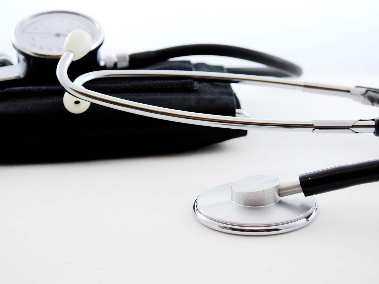 A stethoscope lying on a table promoting wellness